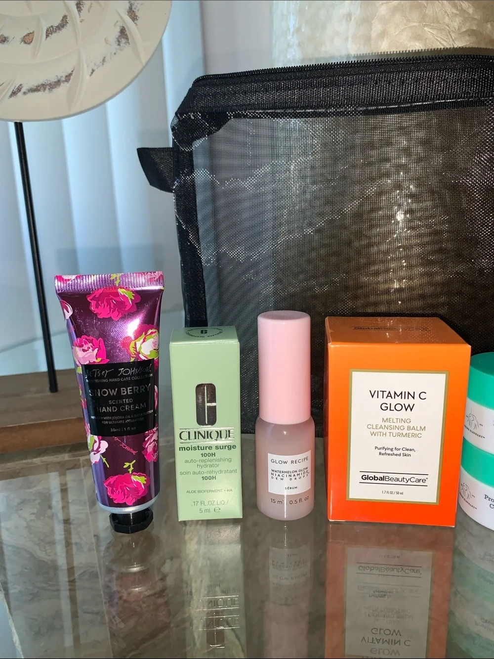 Assorted Skincare & Lip Balms with Black Mesh Cosmetic Pouch